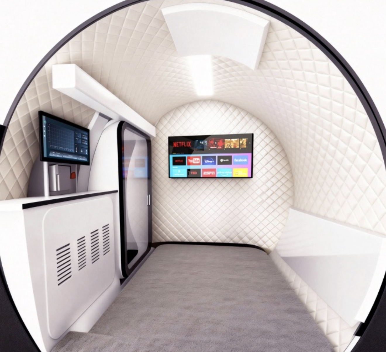 Interior of the Vantis Apex 2 two-person hyperbaric chamber, quilted white cabin with a wall-mounted 43-inch screen and control console